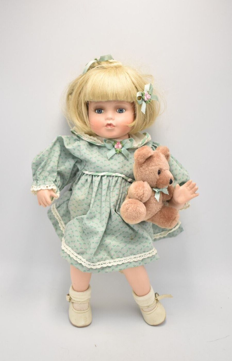 Porcelain doll cheap with teddy bear