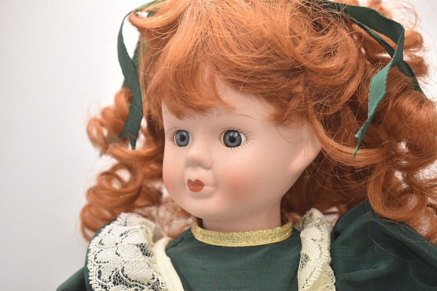 Vintage Porcelain Doll Ginger Hair, Green Eyes and Green Christmas Dress