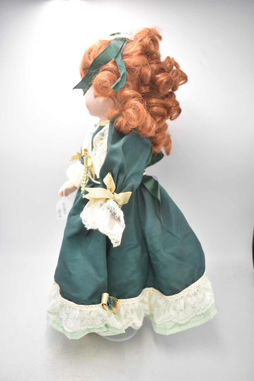 Vintage Porcelain Doll Ginger Hair, Green Eyes and Green Christmas Dress