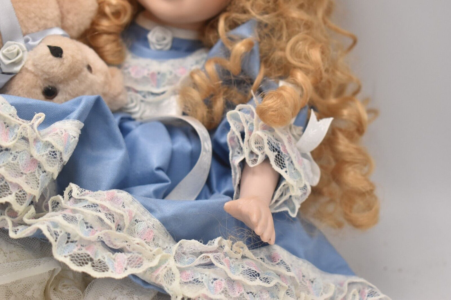 Vintage Porcelain Doll With Teddy Bear Blonde Hair, Blue Eyes and Blue Silk Dres