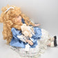 Vintage Porcelain Doll With Teddy Bear Blonde Hair, Blue Eyes and Blue Silk Dres