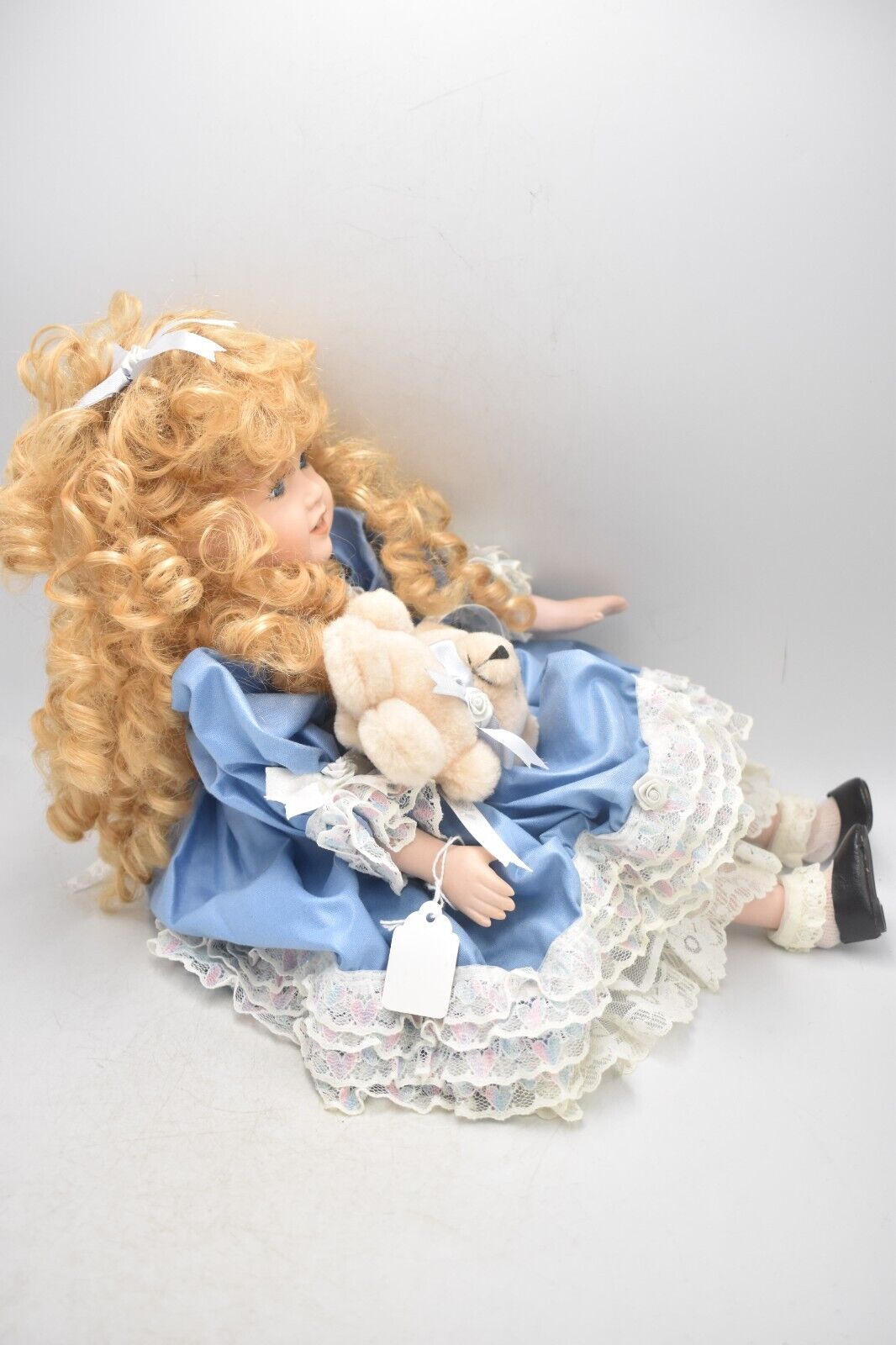 Vintage Porcelain Doll With Teddy Bear Blonde Hair, Blue Eyes and Blue Silk Dres