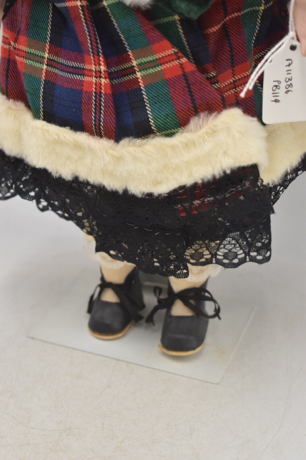 Vintage Porcelain Doll Brown Hair, Green Eyes and Tartan Dress