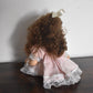 Vintage Bisque Doll Brown Curly Hair, Blue Eyes and Pink Dress