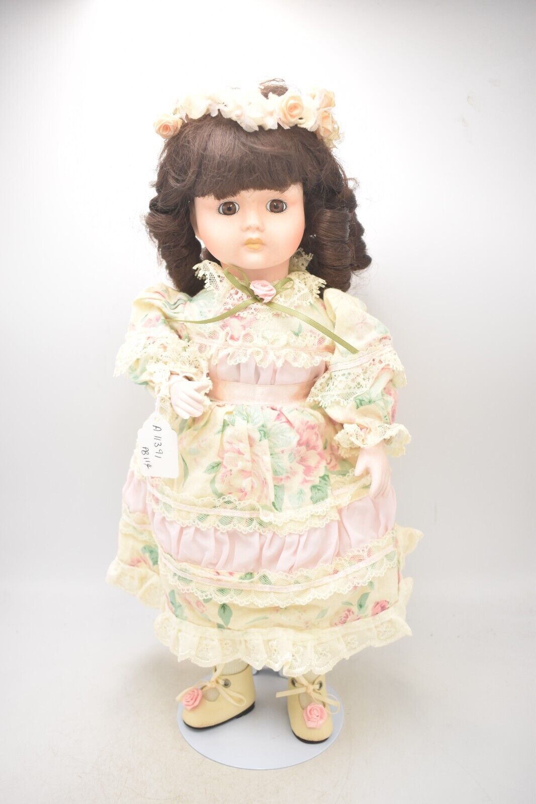 Vintage Porcelain Doll Brown Hair, Brown Eyes and Floral Dress