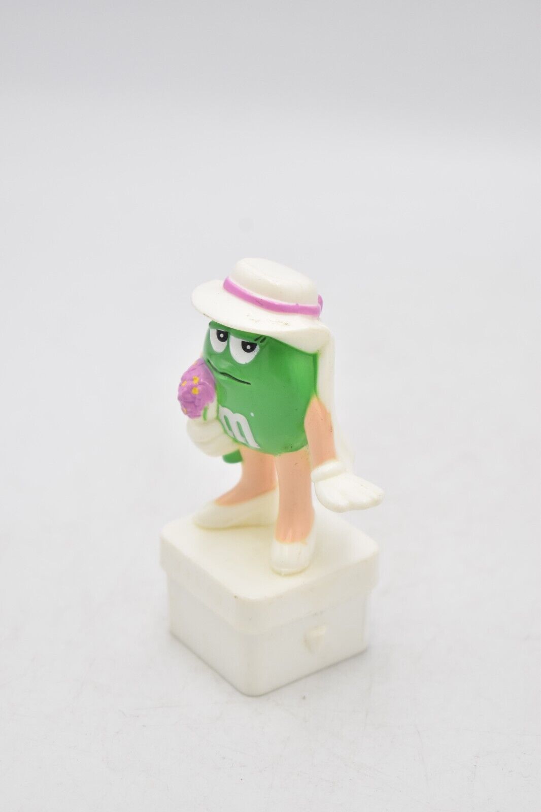 M&M's Ms Green Character Holding Flowers Cake Topper