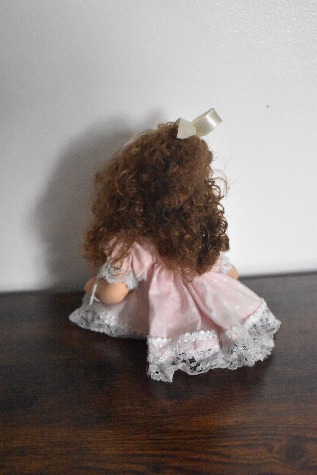 Vintage Bisque Doll Brown Curly Hair, Blue Eyes and Pink Dress