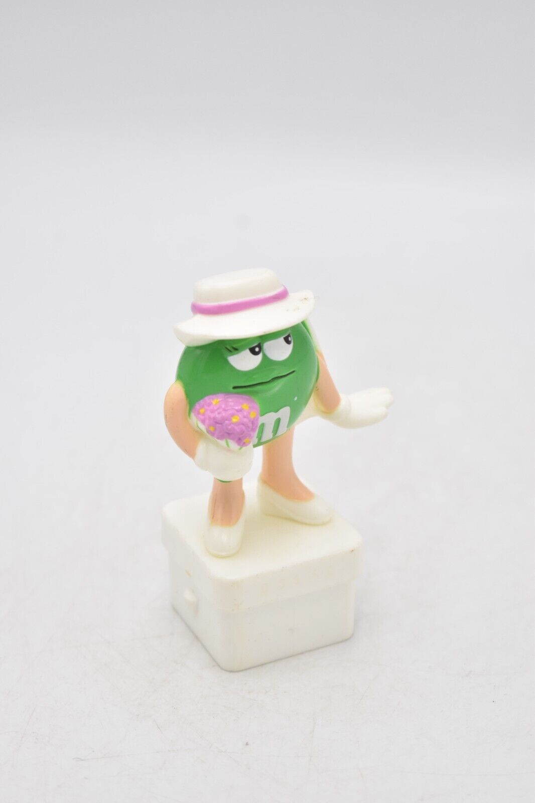 M&M's Ms Green Character Holding Flowers Cake Topper