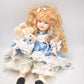 Vintage Porcelain Doll With Teddy Bear Blonde Hair, Blue Eyes and Blue Silk Dres