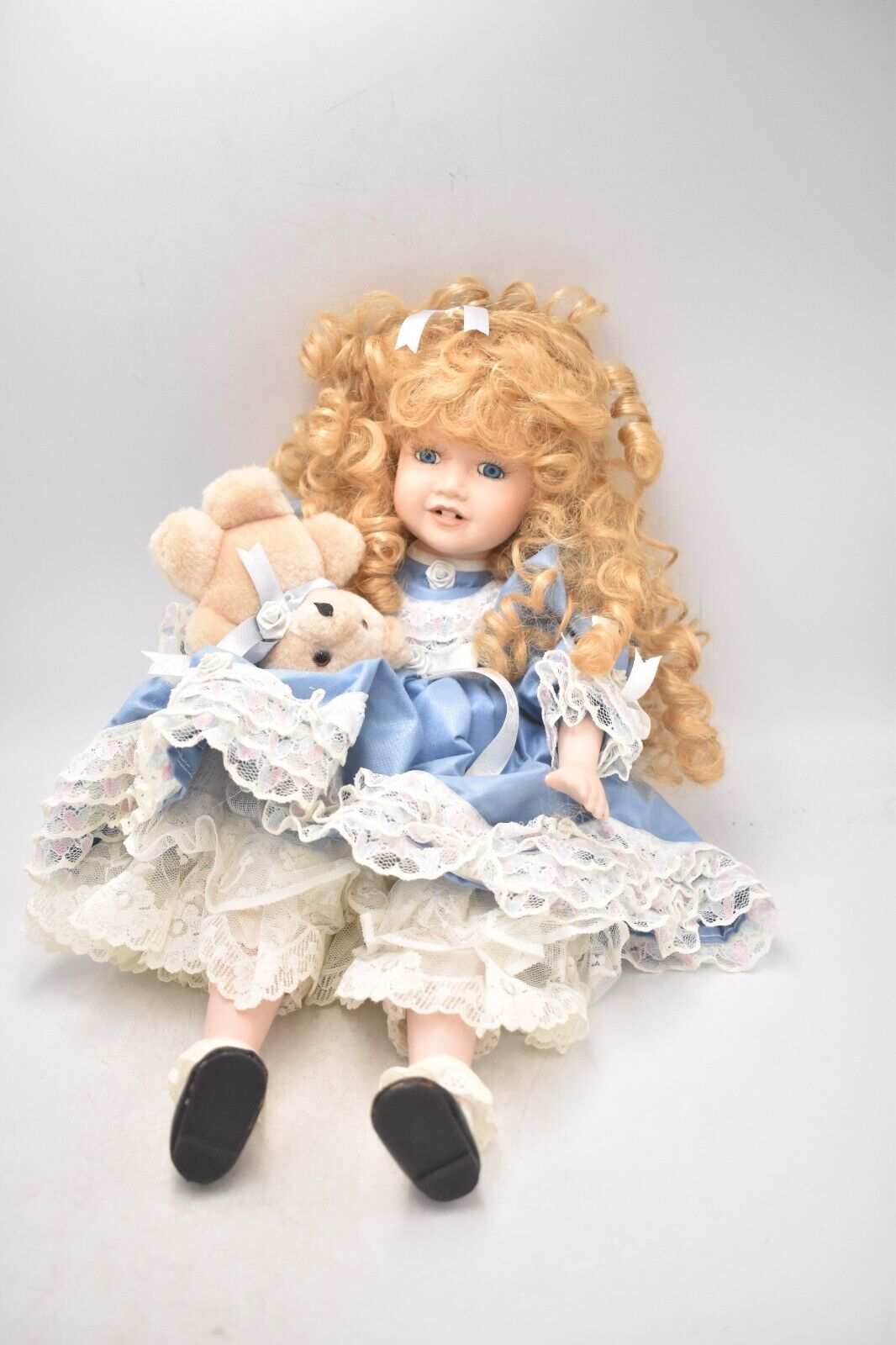 Vintage Porcelain Doll With Teddy Bear Blonde Hair, Blue Eyes and Blue Silk Dres