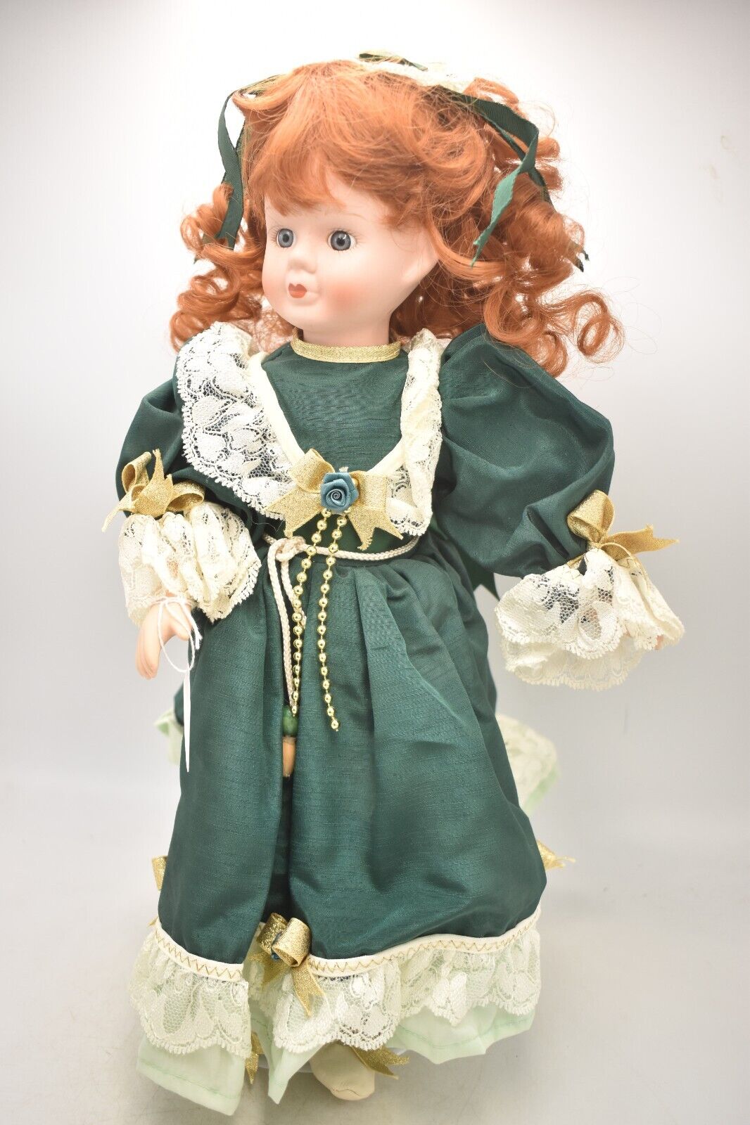 Vintage Porcelain Doll Ginger Hair, Green Eyes and Green Christmas Dress