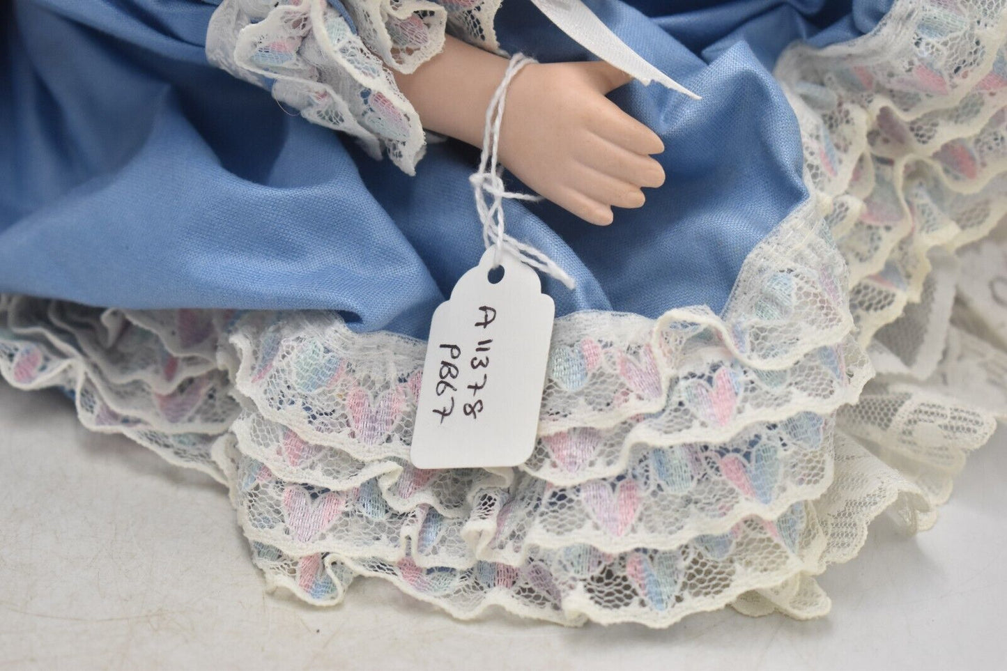 Vintage Porcelain Doll With Teddy Bear Blonde Hair, Blue Eyes and Blue Silk Dres