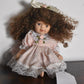 Vintage Bisque Doll Brown Curly Hair, Blue Eyes and Pink Dress