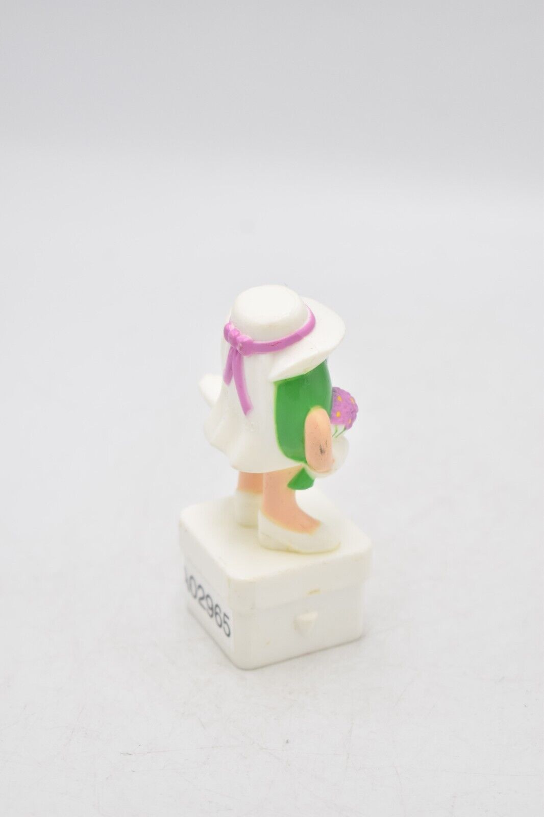 M&M's Ms Green Character Holding Flowers Cake Topper