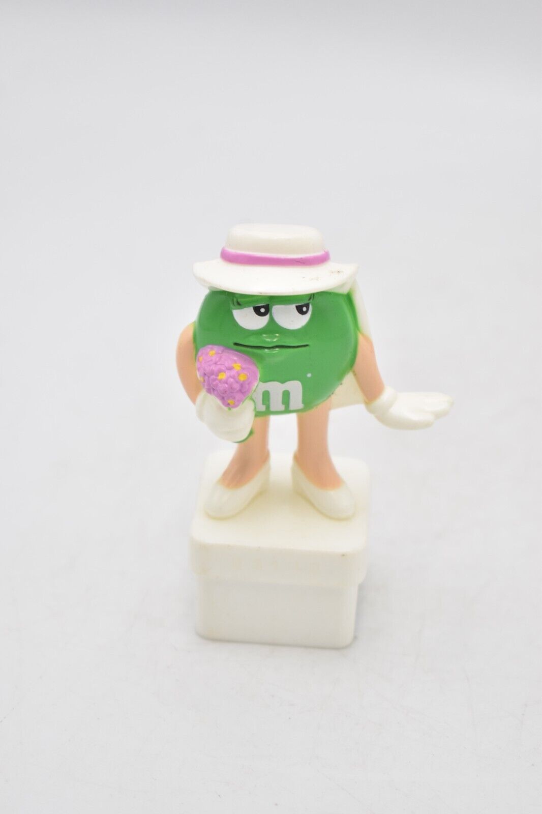 M&M's Ms Green Character Holding Flowers Cake Topper