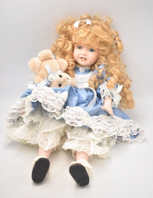 Vintage Porcelain Doll With Teddy Bear Blonde Hair, Blue Eyes and Blue Silk Dres