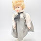 Vintage Porcelain Doll – Blonde Hair, Blue Eyes & Pinafore Dress