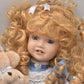 Vintage Porcelain Doll With Teddy Bear Blonde Hair, Blue Eyes and Blue Silk Dres